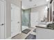 Modern bathroom featuring a glass shower, neutral color palette, tile flooring, and linen closet for storage at 1314 Prescott Circle, Myrtle Beach, SC 29577