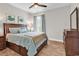 Comfortable bedroom featuring hardwood floors, neutral paint, accent wall art, and lots of natural light at 1314 Prescott Circle, Myrtle Beach, SC 29577