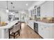 Well-lit kitchen showcasing white cabinets, glass displays, and a wine cooler at 1314 Prescott Circle, Myrtle Beach, SC 29577