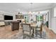 Open-concept living room and dining area with hardwood floors and elegant furnishings at 1314 Prescott Circle, Myrtle Beach, SC 29577