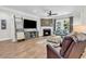 Comfortable living room featuring a fireplace, large windows, and modern decor at 1314 Prescott Circle, Myrtle Beach, SC 29577