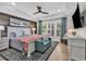 Serene main bedroom boasts a tray ceiling, plank accent wall, and large windows with natural light at 1314 Prescott Circle, Myrtle Beach, SC 29577