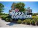 The Market Common sign, surrounded by lush landscaping and clear blue skies at 1314 Prescott Circle, Myrtle Beach, SC 29577
