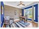 Stylish office with blue accent walls, hardwood flooring, wood paneled accent wall, and bright natural light at 1314 Prescott Circle, Myrtle Beach, SC 29577