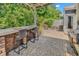 Well-appointed patio showcasing outdoor seating, a bar with chairs, a grill, and lush greenery at 1314 Prescott Circle, Myrtle Beach, SC 29577