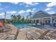 Community pool with plenty of lounge chairs, umbrellas, and a covered area at 1314 Prescott Circle, Myrtle Beach, SC 29577