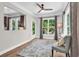 Cozy sun room filled with natural light, hardwood floors, and a relaxing seating area overlooking the backyard at 1314 Prescott Circle, Myrtle Beach, SC 29577