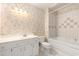 Traditional bathroom with white vanity, decorative wallpaper, and a tub with shower at 137 Hickory Dr., Conway, SC 29526