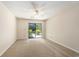 Sunlit bedroom featuring sliding glass door to the outside and neutral carpeting at 137 Hickory Dr., Conway, SC 29526
