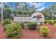 Myrtle Trace, a 55+ covenant restricted retirement community, shown on a large wooden sign at the entrance at 137 Hickory Dr., Conway, SC 29526