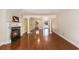 Open-concept living room featuring hardwood floors, fireplace, and kitchen access at 137 Hickory Dr., Conway, SC 29526