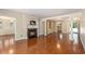Open-plan living room featuring hardwood floors, a fireplace, and open access to other living areas at 137 Hickory Dr., Conway, SC 29526