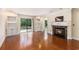Bright living room with built-in shelving, fireplace, and sliding glass doors at 137 Hickory Dr., Conway, SC 29526