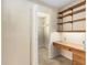 Inviting office area with wooden shelves and desk with a view into the closet at 137 Hickory Dr., Conway, SC 29526