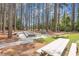 Outdoor recreation area with bocce ball court, picnic tables and towering trees at 137 Hickory Dr., Conway, SC 29526