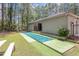 Outdoor shuffleboard court with synthetic turf and building in a private setting at 137 Hickory Dr., Conway, SC 29526