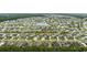 Aerial view of home in neighborhood, highlighting location near a pond and other residences at 138 Copper Leaf Dr., Myrtle Beach, SC 29588