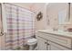Bathroom with decorative mirror, vanity, neutral paint, and a shower-tub combination at 138 Copper Leaf Dr., Myrtle Beach, SC 29588