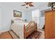 Cozy bedroom with wood floors, a ceiling fan, and a comfortable bed at 138 Copper Leaf Dr., Myrtle Beach, SC 29588