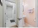Hallway between laundry area and bathroom with pedestal sink and tile floors at 138 Copper Leaf Dr., Myrtle Beach, SC 29588