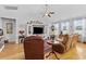 Bright living room featuring hardwood floors, a ceiling fan, and a media center at 138 Copper Leaf Dr., Myrtle Beach, SC 29588