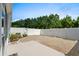 Enclosed backyard patio with stone pavers, a manicured garden and privacy fence at 156 Parmelee Dr. # D, Murrells Inlet, SC 29576