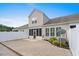 Spacious backyard with a paved patio, privacy fence, and well-maintained landscaping at 156 Parmelee Dr. # D, Murrells Inlet, SC 29576