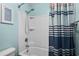 Bathroom with blue walls and shower and tub combo at 156 Parmelee Dr. # D, Murrells Inlet, SC 29576