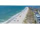 Aerial view of a sunny beach with boardwalk access and nearby homes at 156 Parmelee Dr. # D, Murrells Inlet, SC 29576