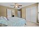 Cozy bedroom featuring a bed, a ceiling fan, and neutral carpeting at 156 Parmelee Dr. # D, Murrells Inlet, SC 29576