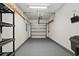 Clean, well-lit garage with an automatic door and shelving at 156 Parmelee Dr. # D, Murrells Inlet, SC 29576