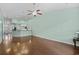 Bright, open living room with hardwood floors, ceiling fan, and view of the kitchen area at 156 Parmelee Dr. # D, Murrells Inlet, SC 29576