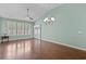 Inviting living room with hardwood floors, plantation shutters, and a ceiling fan for added comfort at 156 Parmelee Dr. # D, Murrells Inlet, SC 29576