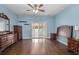 Main bedroom features hardwood floors and sliding glass doors to the outside at 156 Parmelee Dr. # D, Murrells Inlet, SC 29576