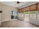 Cozy sun room featuring tile floors, neutral decor, and sliding glass doors to the outdoors at 156 Parmelee Dr. # D, Murrells Inlet, SC 29576