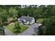 Aerial view of a charming two-story home surrounded by lush greenery at 160 Comanche Dr., Georgetown, SC 29440