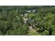 Aerial view of a house surrounded by trees near a river at 160 Comanche Dr., Georgetown, SC 29440