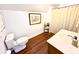 Cozy bathroom featuring hardwood floors, a framed art piece, and a lovely vanity with modern finishes at 160 Comanche Dr., Georgetown, SC 29440