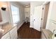 Bathroom showcasing wood floors, granite vanity, neutral paint, and a separate toilet area at 160 Comanche Dr., Georgetown, SC 29440