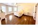 Bright bedroom with hardwood floors, a ceiling fan, lots of light and a charming bed at 160 Comanche Dr., Georgetown, SC 29440