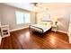 Bedroom featuring wood floors, neutral walls, modern lighting, and a comfortable queen-size bed at 160 Comanche Dr., Georgetown, SC 29440