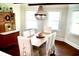 Cozy dining room with chandelier lighting, a table for six, and vintage decor at 160 Comanche Dr., Georgetown, SC 29440