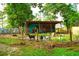 Small farm or homestead featuring a quaint outdoor structure and goats grazing behind a wire fence at 160 Comanche Dr., Georgetown, SC 29440