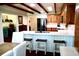 Spacious kitchen with wooden cabinets, white countertops, island seating and stainless appliances at 160 Comanche Dr., Georgetown, SC 29440