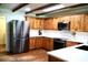 Bright kitchen with wooden cabinets, subway tile backsplash, and stainless steel appliances at 160 Comanche Dr., Georgetown, SC 29440