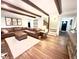 Spacious living room featuring exposed wood beams, a sectional sofa, and a cozy atmosphere at 160 Comanche Dr., Georgetown, SC 29440