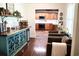 Inviting living room flows into a modern kitchen with wood cabinets and stainless steel appliances at 160 Comanche Dr., Georgetown, SC 29440