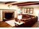 Elegant living room with exposed beams, brick fireplace and stylish decor at 160 Comanche Dr., Georgetown, SC 29440