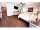 Bright main bedroom featuring a ceiling fan, wood flooring, flamingo artwork, and neutral tones at 160 Comanche Dr., Georgetown, SC 29440
