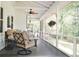 Comfortable screened-in porch with ceiling fan and cushioned chairs, great for relaxing outdoors at 160 Comanche Dr., Georgetown, SC 29440